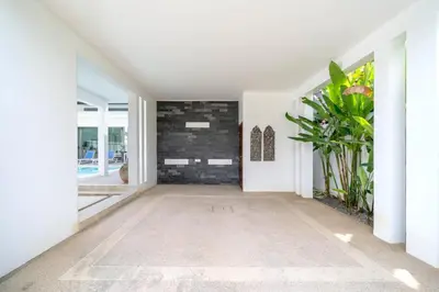 a hallway of a house with a plant at 2 BR Pool Villa Isawan near Nai Harn in Ban Saiyuan (1)