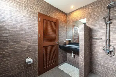 a bathroom with a sink and a shower at 3 BR Pool Villa Salika near Rawai Beach in Ban Saiyuan (1)