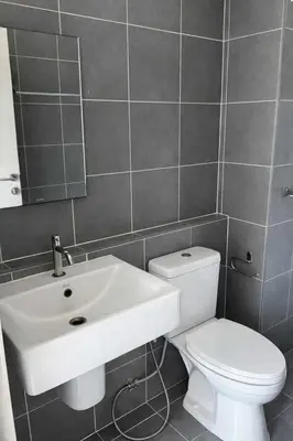 a bathroom with a white sink and a toilet at D Condo Mine Kathu Smart Monthly Living 30-Day Stay in Kathu