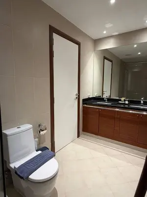 a bathroom with a white toilet and a sink at Harmony 3 Bedrooms Private Pool Villa in Laguna Phuket