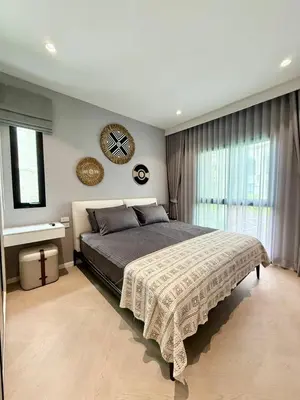 a bedroom with a large bed and a large window at Bali Essence, The Title BangTao in Bang Tao Beach