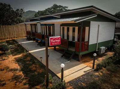 a tiny house with a sign in front of it at The Nap Koh Yao Yai in Ban Nai Wat