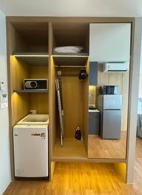 a small room with a small refrigerator and a microwave at Wyndham apartment Naithon in Nai Thon Beach
