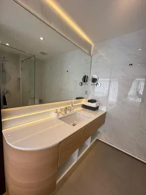 a bathroom with a sink and a large mirror at Wyndham apartment Naithon in Nai Thon Beach