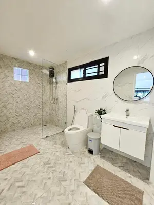 a bathroom with a toilet and a sink and a mirror at Boutique pool villa in Soi Bell,Kamala in Kamala Beach