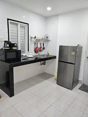 a kitchen with a counter and a refrigerator at Large 1 Bedroom Apt Sleeps 4, Close to Beach - RM 1 in Ban Lum Fuang