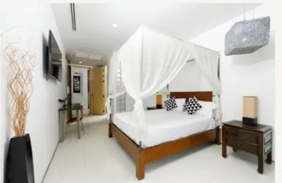 a bedroom with a bed with a canopy at Atika Villa 6 ocean view pool villa in Patong Beach