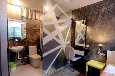 a bathroom with a shower and a sink and a toilet at Phuket Paradiso in Chalong