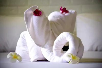 a couple of towels sitting on top of a bed at Wan Wan Place in Ao Nang Beach