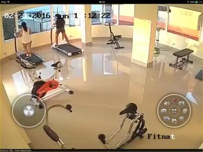 a gym with two people exercising on exercise bikes at Smile Residence in Rawai Beach