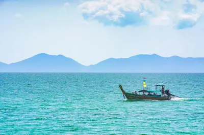 a boat in the middle of a large body of water at Anyavee Krabi Beach Resort in Klong Muang Beach