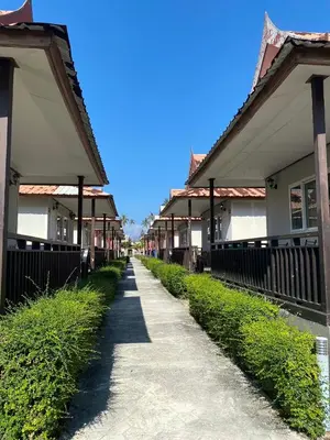 a walkway through a row of houses at Phi Phi Little Star Resort in Phi Phi Don