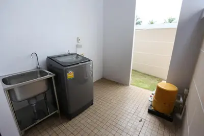 a small bathroom with a sink and a trash can at Baan Ping Tara Private Pool Villa in Ao Nang Beach