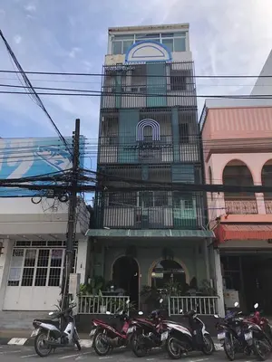 a group of motorcycles parked in front of a building at Sleep at Phuket SHA Plus in Phuket Town
