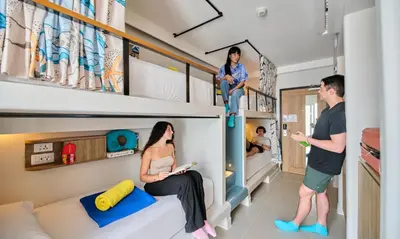 a family in a room with bunk beds at Lub d Phuket Patong - Near Patong Beach & Vibrant Social Vibe in Patong Beach