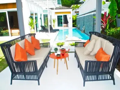 a patio with two wicker chairs and a table at Skylight 2 bedrooms Villa in Kamala in Kamala Beach