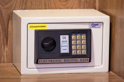 a electronic digital scale sitting on top of a table at Patong Holiday Dream Hotel in Patong Beach