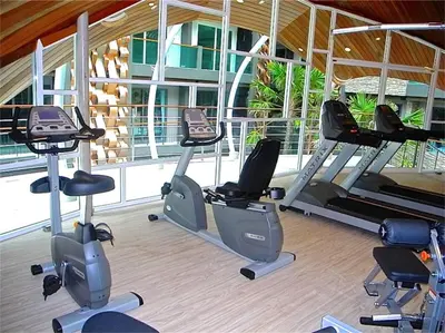 a gym with several exercise bikes in a room at Emerald Patong 1 bedroom Modern Apartment in Patong Beach
