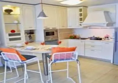 a kitchen with a table and chairs in a room at Patong Tower 1-Bedroom Apartment Full Sea View in Patong Beach