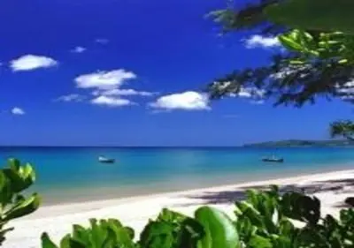 a view of a beach with boats in the water at Eva Villa Rawai 3 bedrooms Private Pool in Rawai Beach