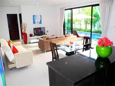 a living room with a couch and a table at Intira Villa Rawai 2 bedrooms Villa in Rawai Beach