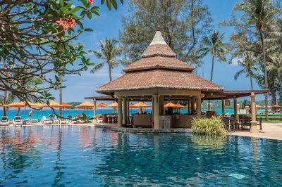 a pool at a resort with a gazebo at Beyond Kata in Kata Beach