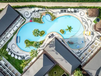 an overhead view of a pool at a resort at Amora Beach Resort Phuket in Bang Tao Beach