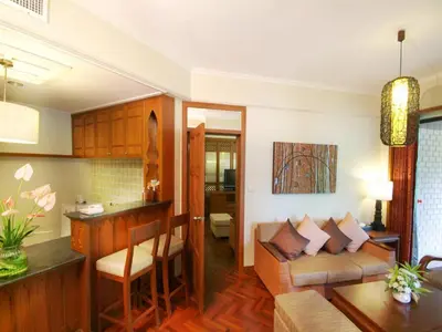 a living room with a couch and a table at Krabi Resort in Ao Nang Beach