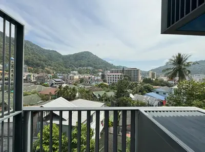 a balcony with a view of a city at The Deck Condominium by Lofty in Patong Beach