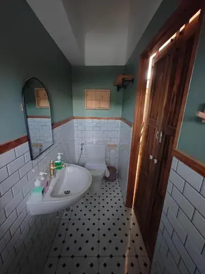 a bathroom with a sink and a toilet at Namphung Phuket Boutique Resort in Rawai Beach