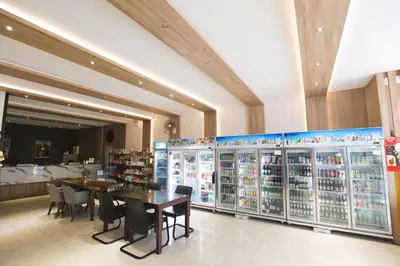 a store with a table and chairs in a room at Sun Sea Sand Patong in Patong Beach
