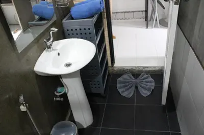 a small bathroom with a sink and a mirror at B Happy Resort - SHA ExtraPlus in Kamala Beach
