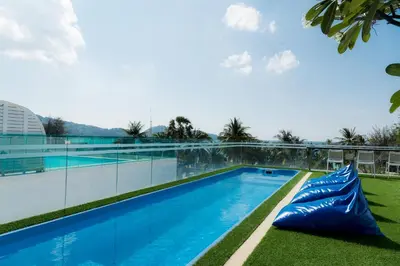 a large swimming pool on top of a building at BearPacker Patong Hostel in Patong Beach