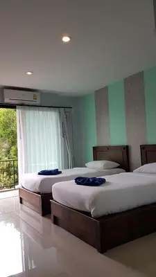 a bedroom with two beds and a window at Krabi Lighthouse @ Aonang in Ao Nang Beach