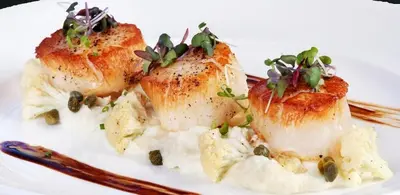 a white plate with two pieces of food on it at The Retreat Ao nang Private Pool Villa in Ao Nang Beach