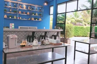 a restaurant with a table with candles on it at The Malika Hotel - SHA Extra Plus in Phuket Town