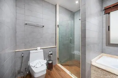 a bathroom with a shower and a toilet and a sink at Villa Bond 3BR Private Pool Near Naiharn Beach in Rawai Beach