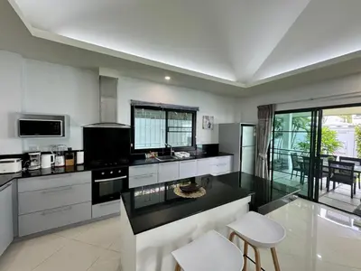 a kitchen with a stove and a counter top at Gabriel Villa by G Estate in Rawai Beach