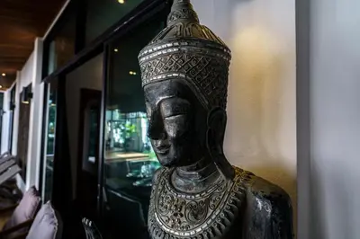 a statue of a head on a wall at Emotion 2 Villa by G Estate in Rawai Beach