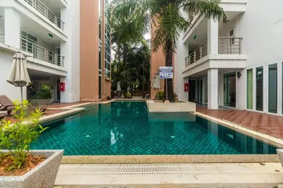 a swimming pool in the middle of a building at Heaven Lagoon Condo by Lofty in Patong Beach