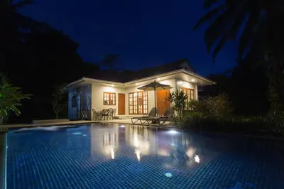 a swimming pool in front of a house at night at Alisea Pool Villa Aonang in Ao Nang Beach