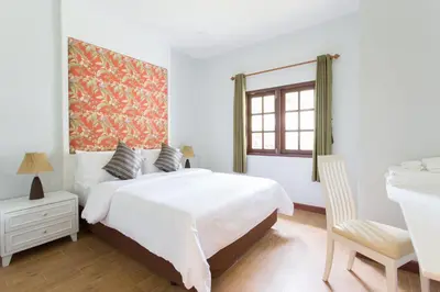 a white bedroom with a large bed and a desk at Alisea Pool Villa Aonang in Ao Nang Beach