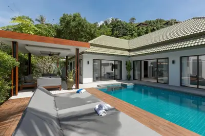 a swimming pool in the backyard of a house at Karon Beach Pool Villa - Sha Extra Plus in Karon Beach