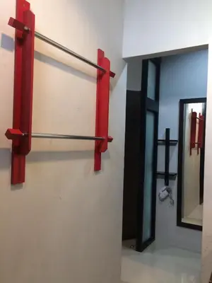 a bathroom with red towel racks on the wall at S2 Residence in Ao Nang Beach