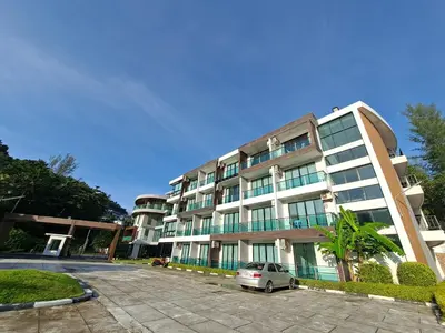 a building with a car parked in front of it at The Naithorn Condo Unit 401 in Nai Thon Beach