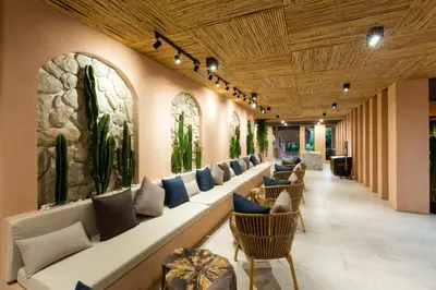 a row of couches in a waiting room at Amala Grand Bleu Resort Hilltops - SHA in Kamala Beach