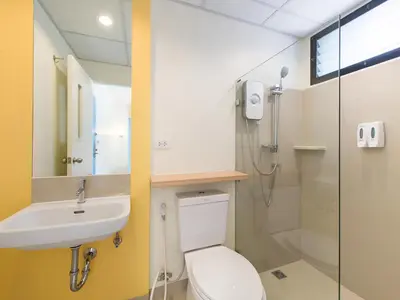 a bathroom with a toilet and a sink and a shower at HOP INN Phuket in Phuket Town