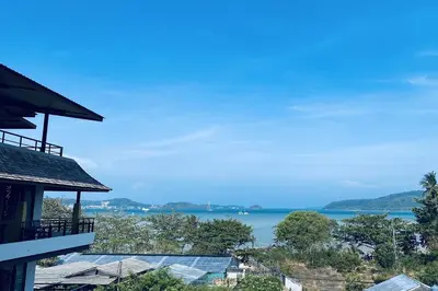 a view of the water from a house at Aqua Resort Phuket - Near Beach and Chalong Pier in Rawai Beach