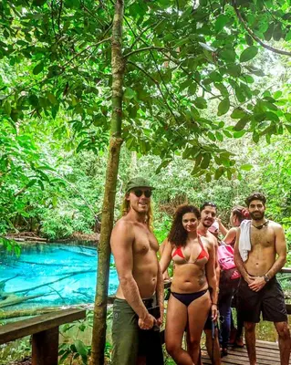 a group of people standing in front of a river at K-Bunk AoNang Center in Ao Nang Beach