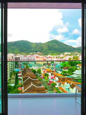 a view of a city from a window at Phoenix Grand Patong in Patong Beach